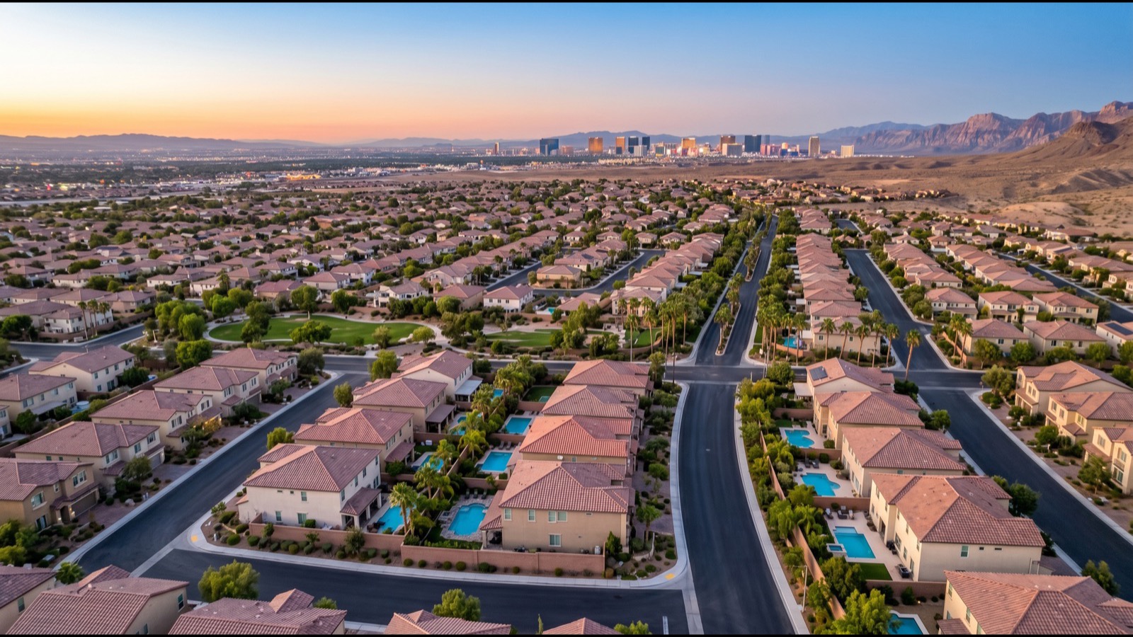 Aerial view of Panorama Towers' three-tower complex on Dean Martin Drive showing the three residential buildings, the central pool deck, and the broader Las Vegas Strip corridor in the background